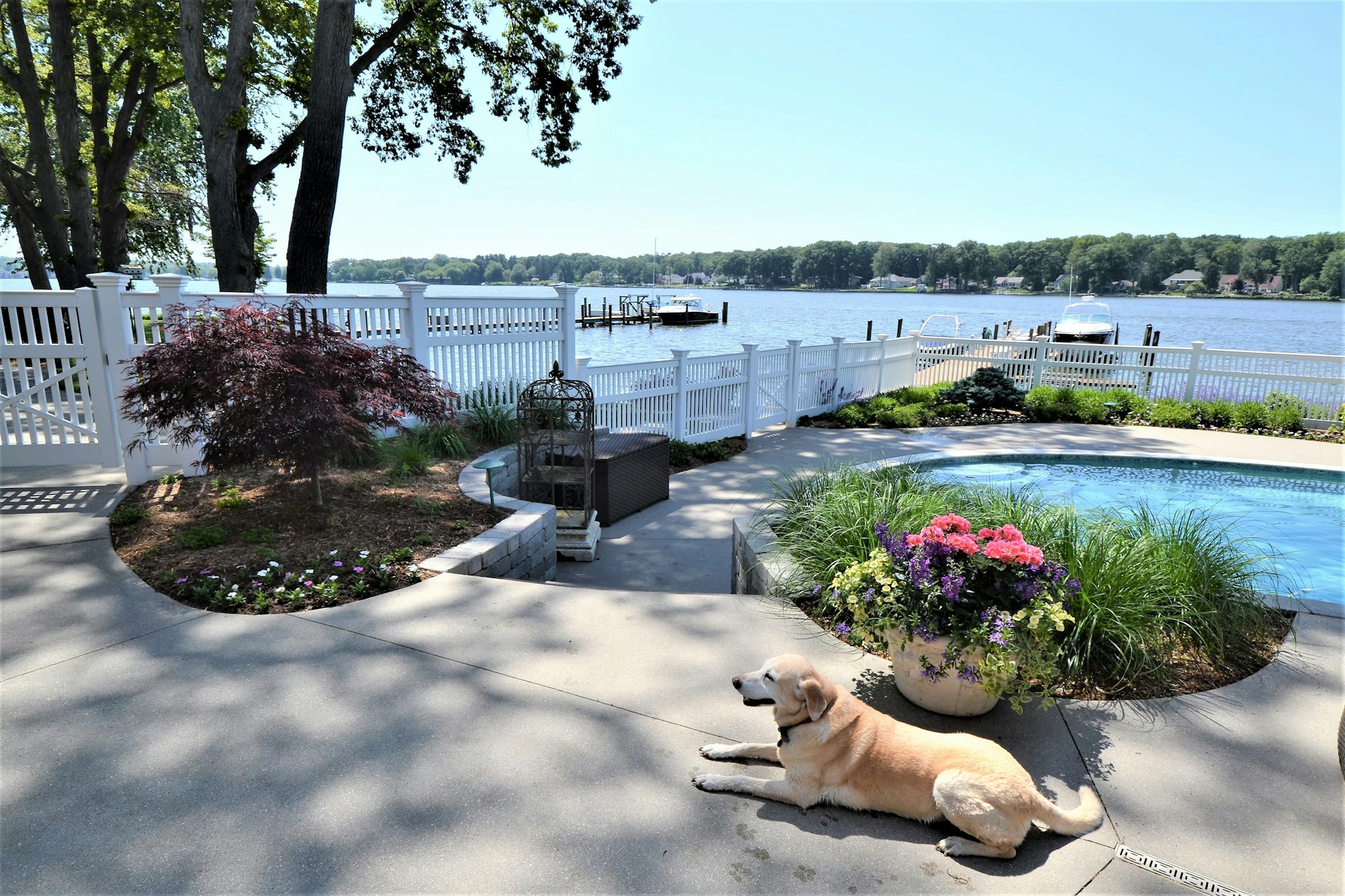 Backyard living space on the lake with swimming pool